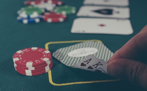 cards and chips on a poker table in a casino